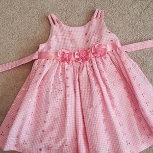 Pink dress with ribbon rosettes